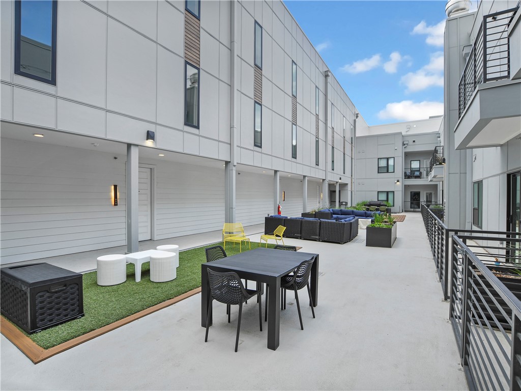 2220 Webberville Road, Unit 308 Austin, TX 78702 - Photo 13 of 21 Outdoor courtyard with artificial turf area and areas to hang out with friends