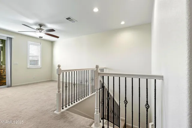 a view of a hallway with windows