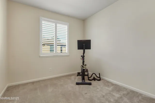 a room with gym equipment and a window