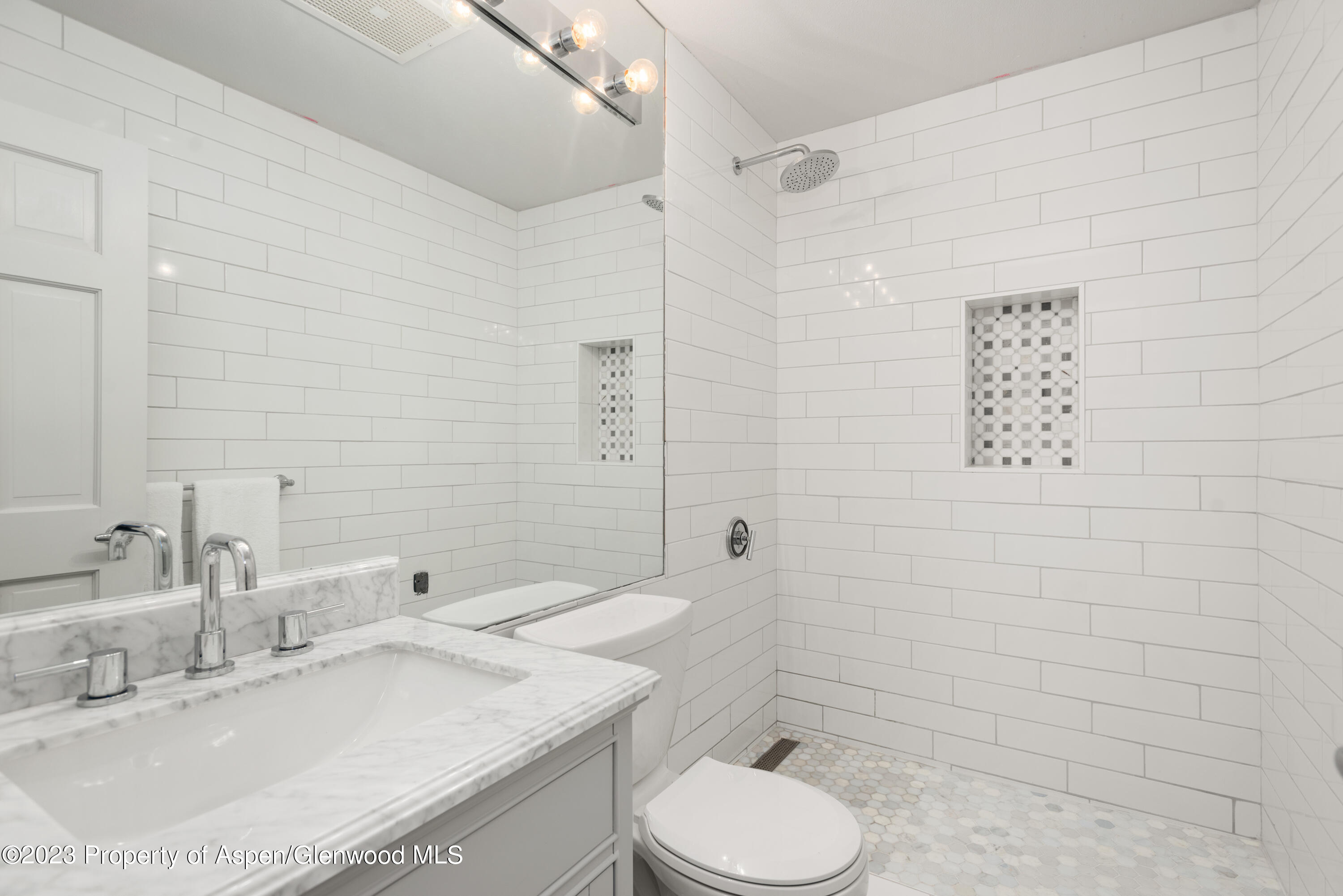 1436 Crystal Lake Road, Unit 4B Aspen, CO 81611 - Photo 11 of 22 a bathroom with a sink toilet and shower