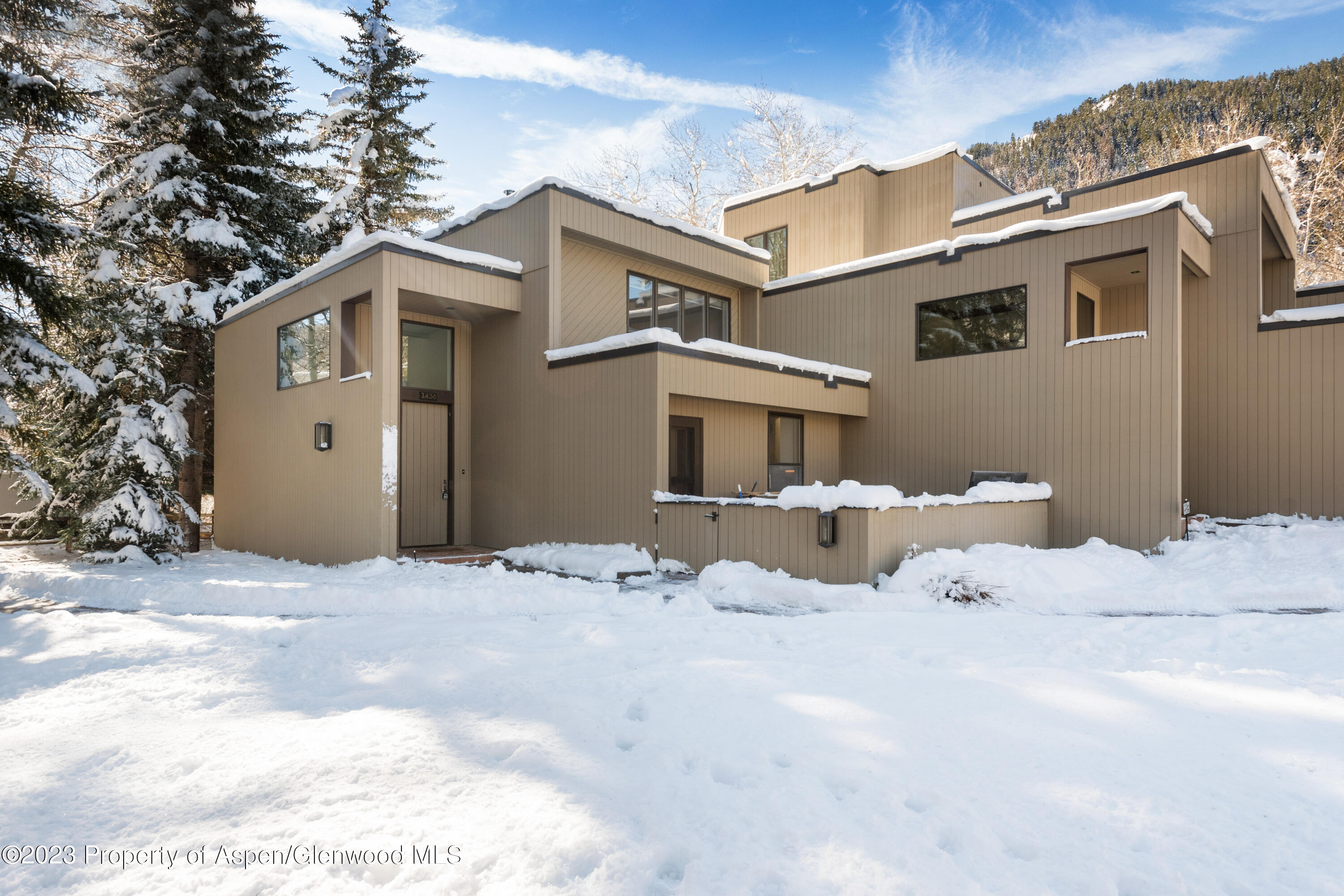 1436 Crystal Lake Road, Unit 4B Aspen, CO 81611 - Photo 19 of 22 a front view of a house with a yard