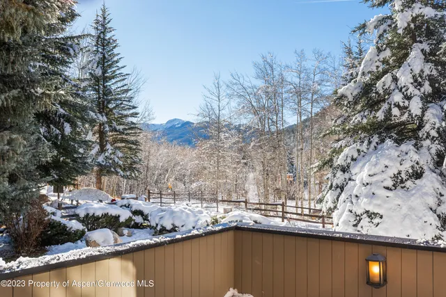 a view of a lake with a tree
