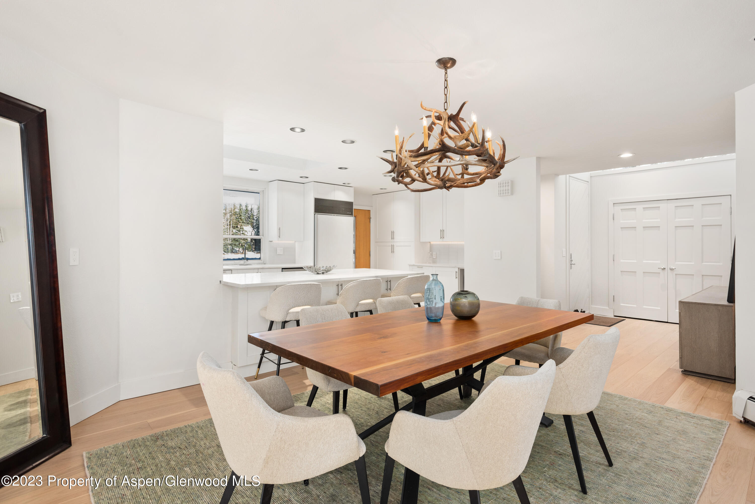1436 Crystal Lake Road, Unit 4B Aspen, CO 81611 - Photo 5 of 22 a view of a dining room with furniture and wooden floor