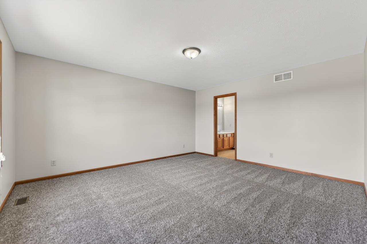 676 Elberon Way Roscoe, IL 61073 - Photo 17 of 30 a view of an empty room and window