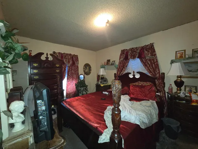 a living room with furniture and a lamp