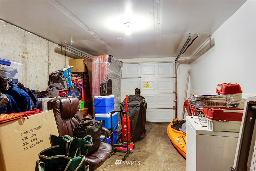 3935 Mason Loop Road Tacoma, WA 98409 - Photo 23 of 24 a storage room with washer and dryer