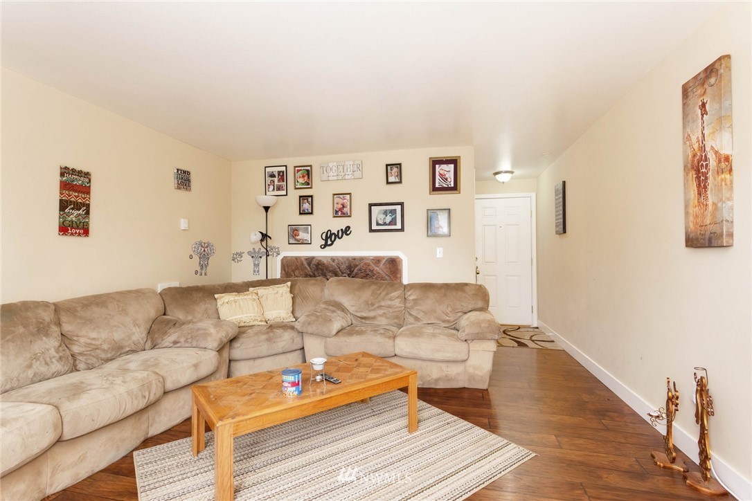 3935 Mason Loop Road Tacoma, WA 98409 - Photo 7 of 24 a living room with furniture and wooden floor