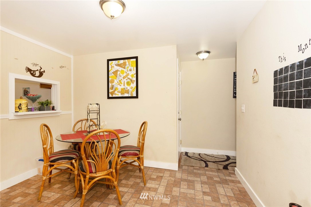 3935 Mason Loop Road Tacoma, WA 98409 - Photo 10 of 24 a dining room with furniture and window
