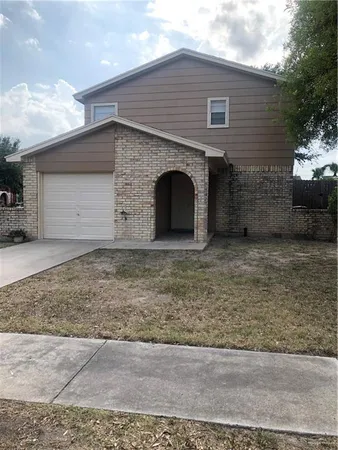 a front view of a house with yard