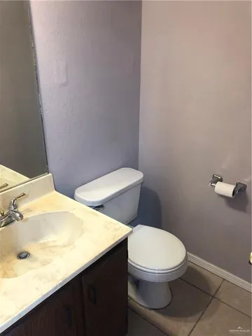 a bathroom with a toilet and bathtub