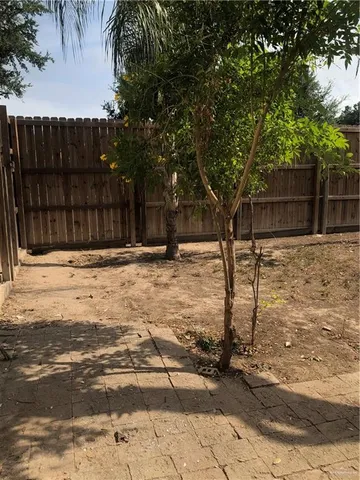 a view of a backyard of the house