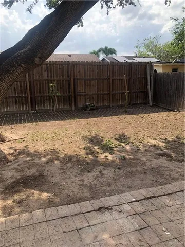 a view of a backyard of the house
