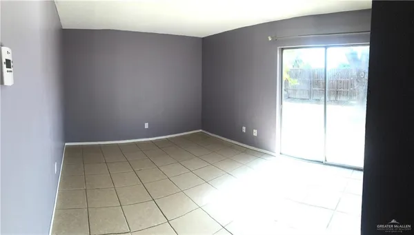 a kitchen with a refrigerator and a sink