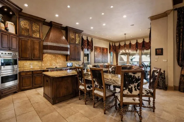 a kitchen with a counter space a sink and appliances