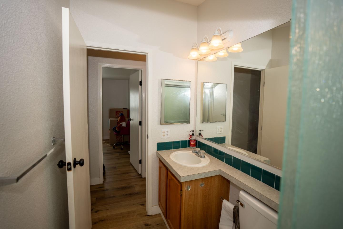 20 Russell Road, Unit 133 Salinas, CA 93906 - Photo 15 of 18 a bathroom with a sink and a mirror