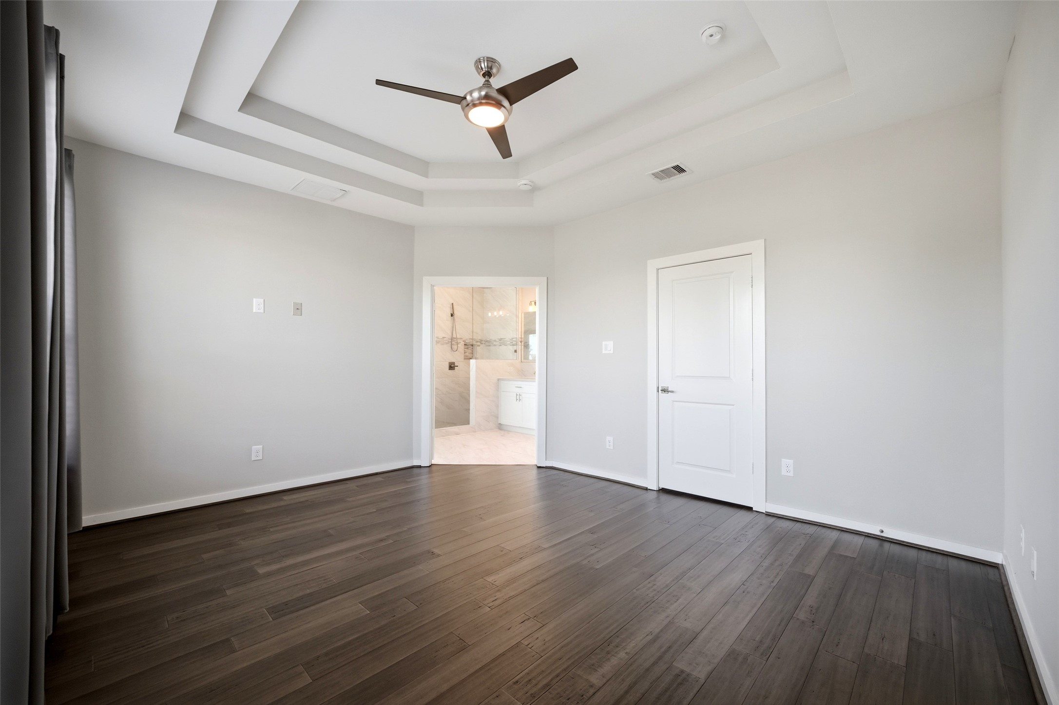 605 Dumble Street Houston, TX 77023 - Photo 23 of 44 a view of an empty room with wooden floor