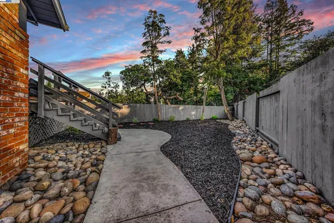 a view of a pathway with a yard