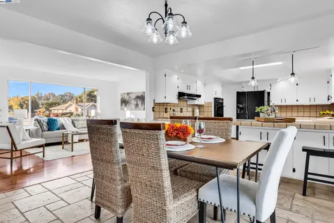 a view of kitchen with dining table and chairs