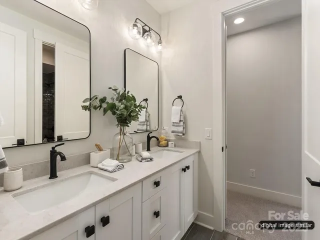 a bathroom with a double vanity sink and a mirror