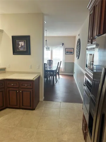 a view of kitchen with granite countertop lots of counter top space