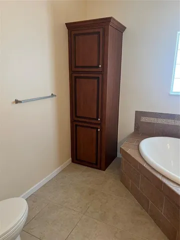 a bathroom with a sink a toilet and tub