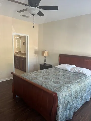 a bedroom with a bed and a dresser