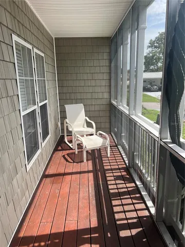 a balcony with wooden floor