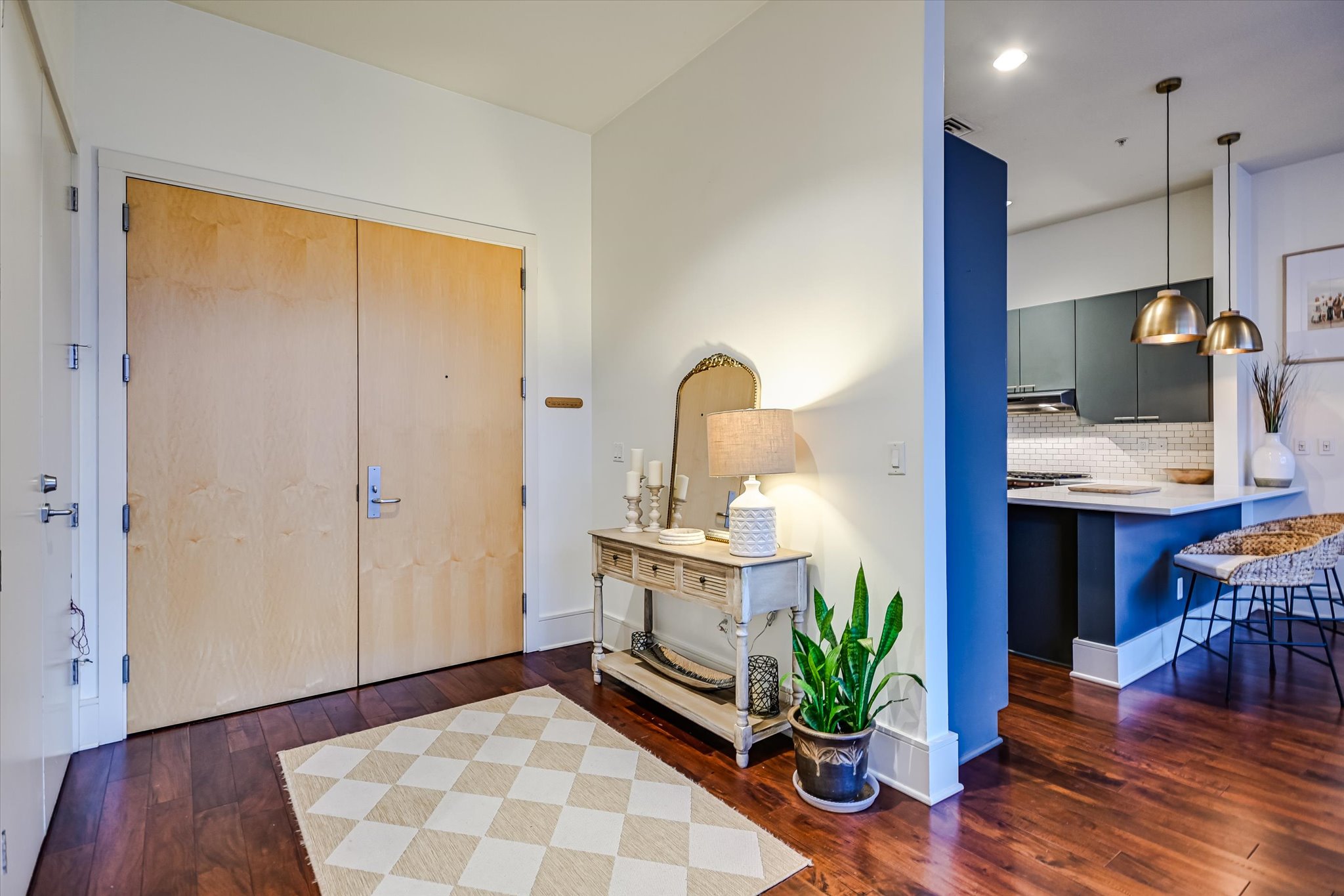 555 East 5th Street, Unit 2826 Austin, TX 78701 - Photo 14 of 40 a kitchen with a sink and wooden floor