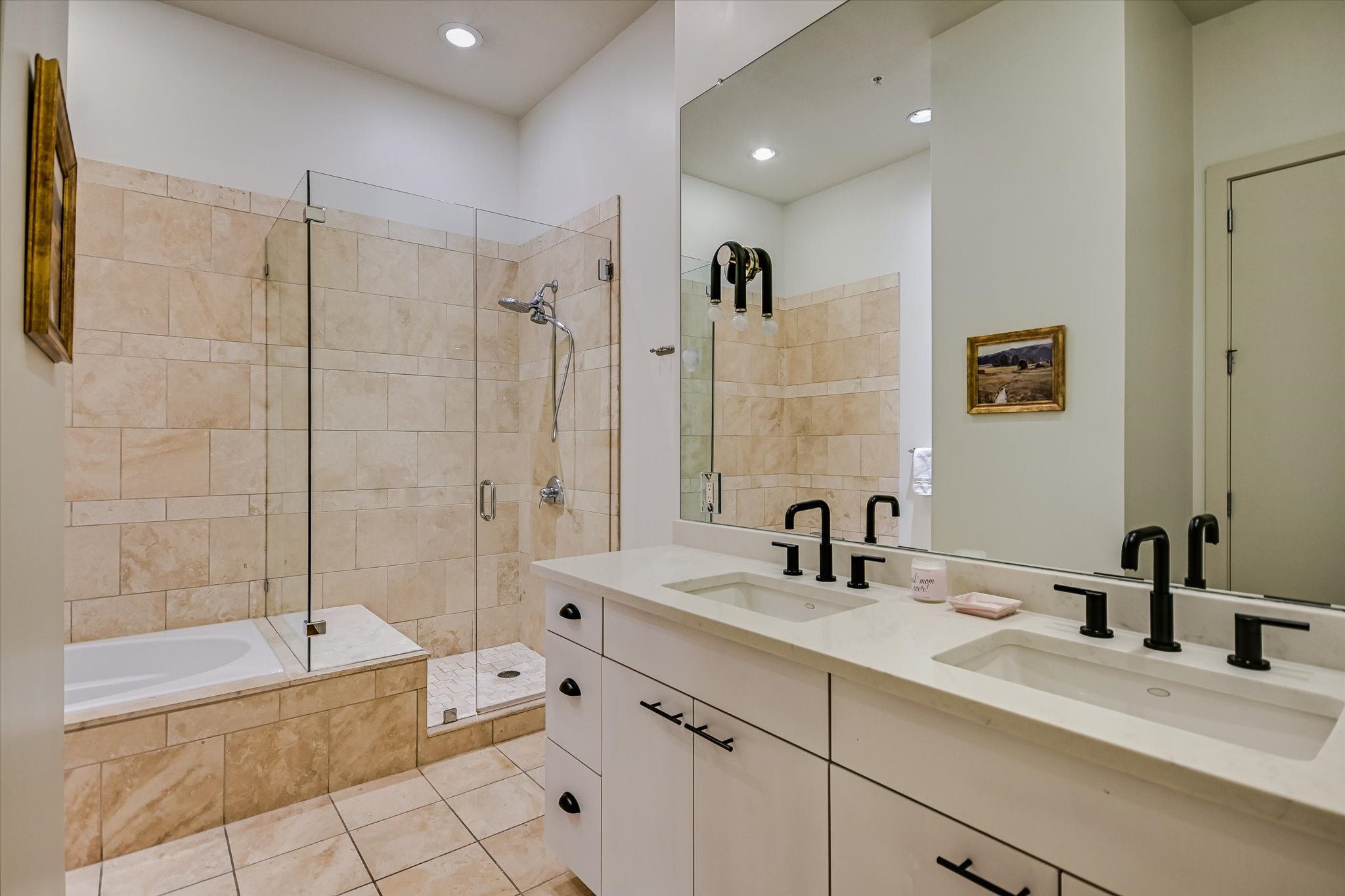 555 East 5th Street, Unit 2826 Austin, TX 78701 - Photo 17 of 40 a bathroom with a tub sink double vanity and a shower