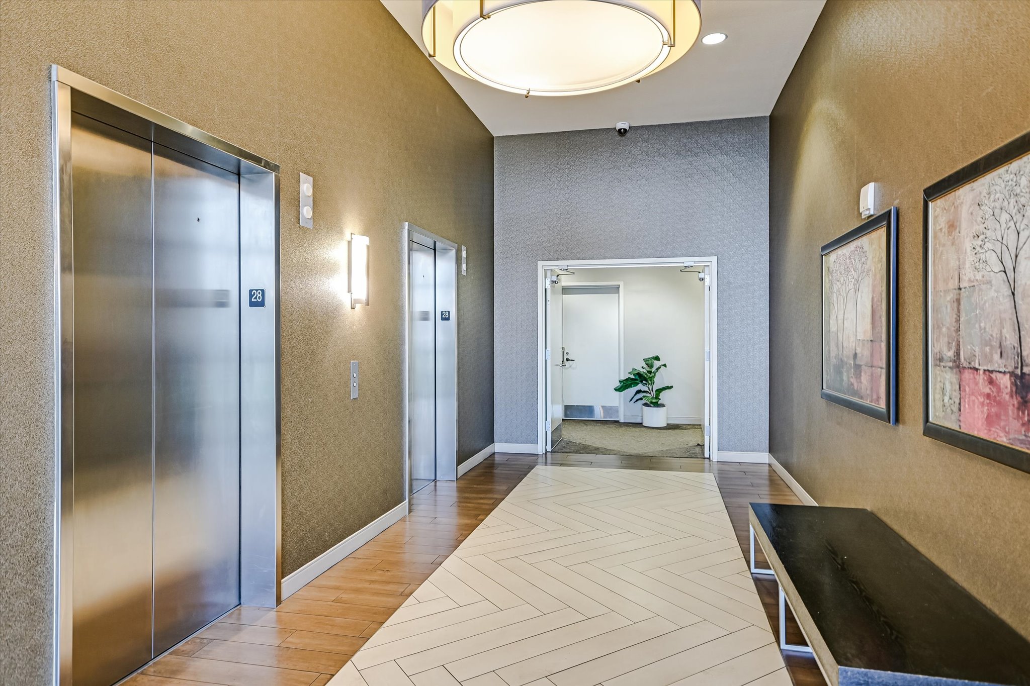 555 East 5th Street, Unit 2826 Austin, TX 78701 - Photo 26 of 40 a view of a hallway with wooden floor and a living room
