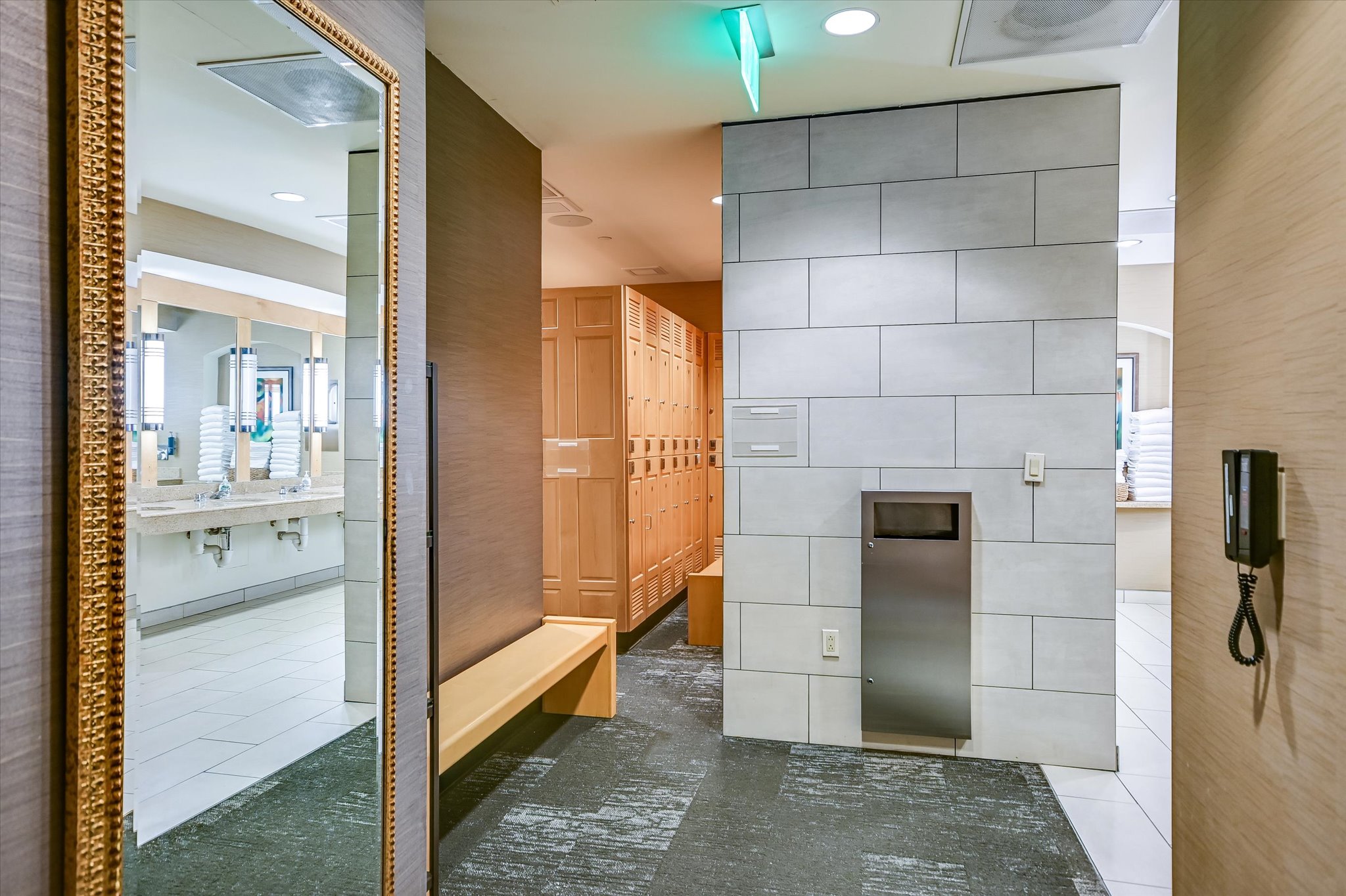 555 East 5th Street, Unit 2826 Austin, TX 78701 - Photo 37 of 40 a bathroom with a glass shower door and a mirror