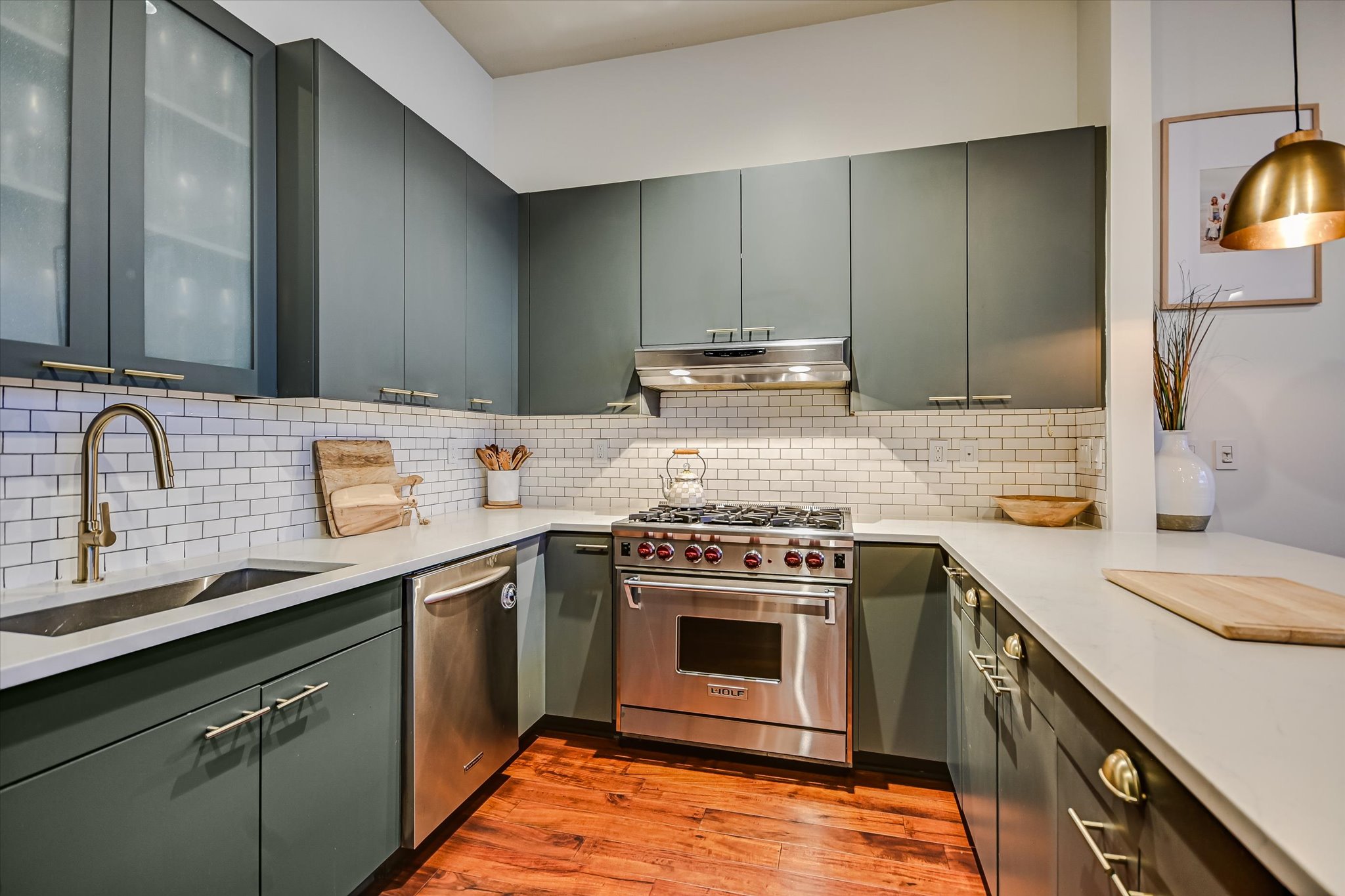 555 East 5th Street, Unit 2826 Austin, TX 78701 - Photo 10 of 40 a kitchen with a stove sink and cabinets