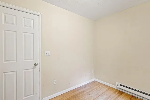 a view of a small space with wooden floor