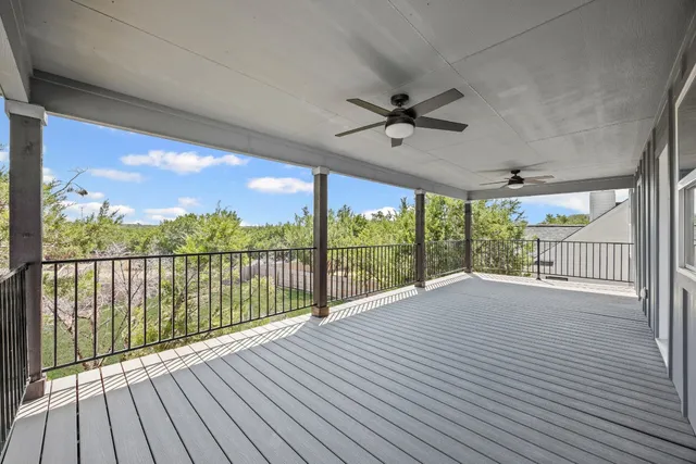 a view of a balcony with wooden floor