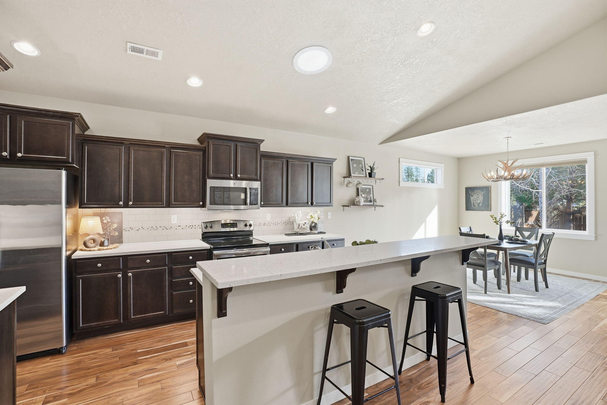 1255 McKinney Butte Road, Unit E Sisters, OR 97759 - Photo 14 of 43 Great Room Kitchen with Dining Bar