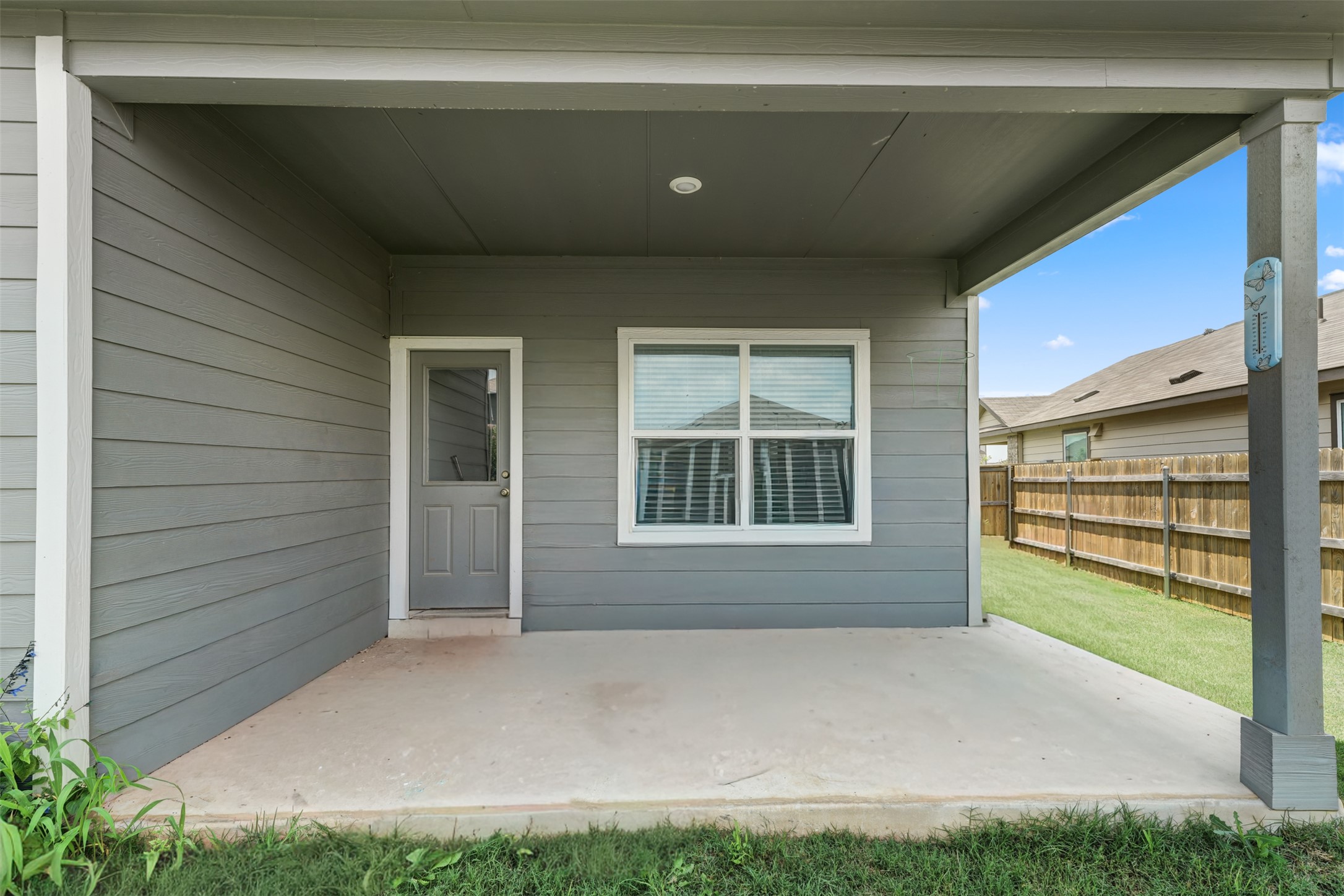 413 Perfect World Loop Jarrell, TX 76537 - Photo 33 of 39 A well-proportioned covered patio offers a comfortable outdoor retreat with direct backyard access.