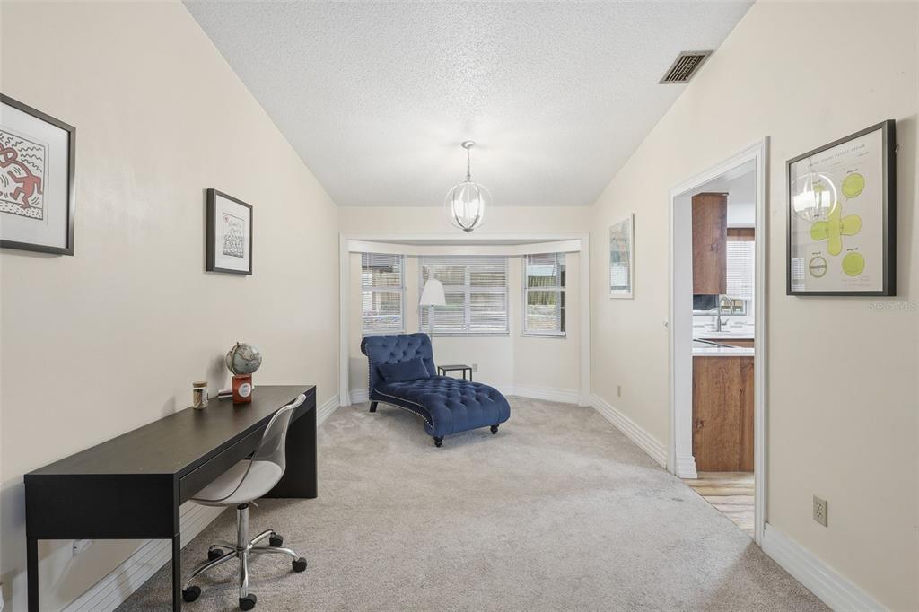 244 Angeles Road DeBary, FL 32713 - Photo 13 of 41 a workspace with furniture and window