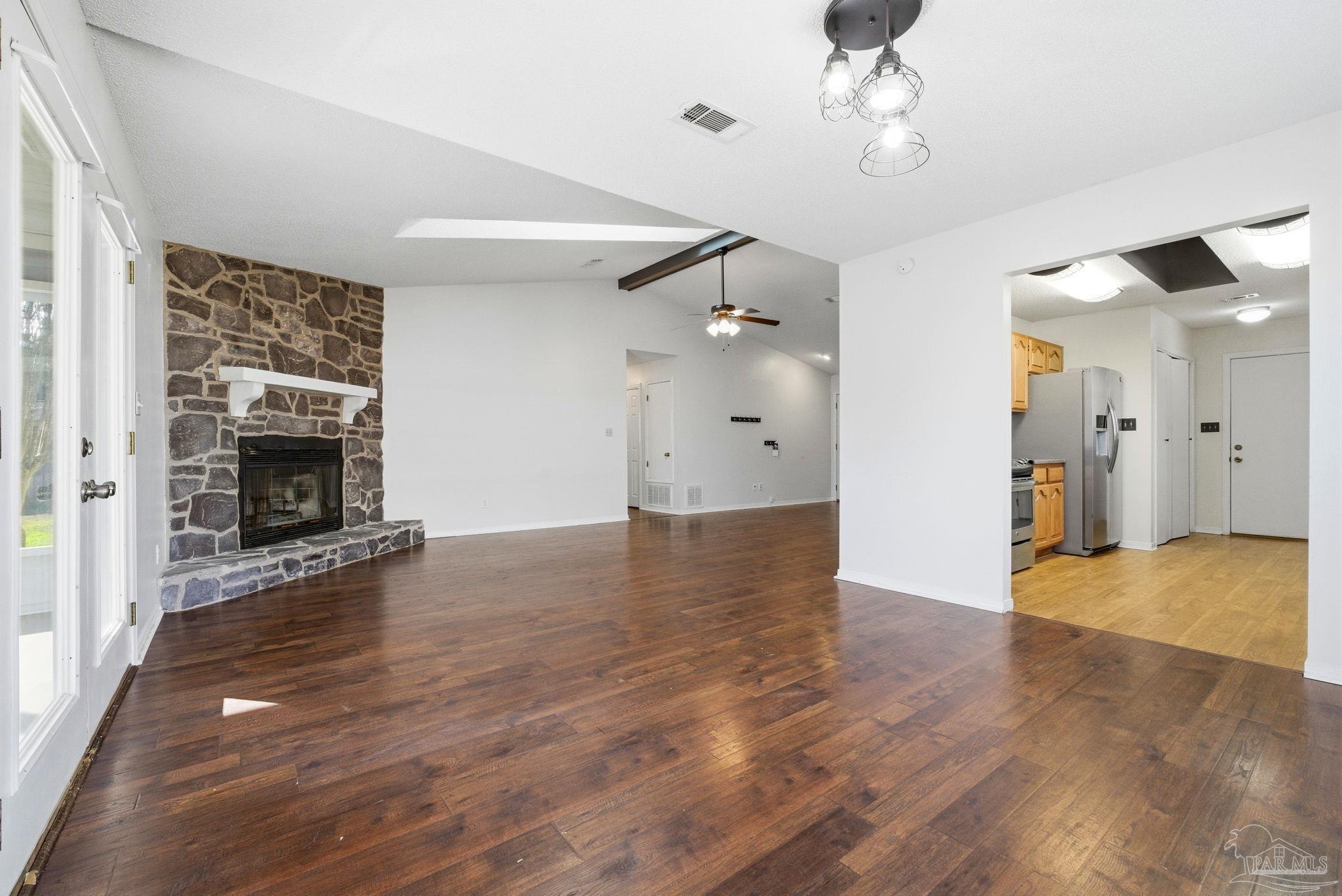 3228 Copper Ridge Circle Cantonment, FL 32533 - Photo 14 of 41 wooden floor in an empty room with a fireplace