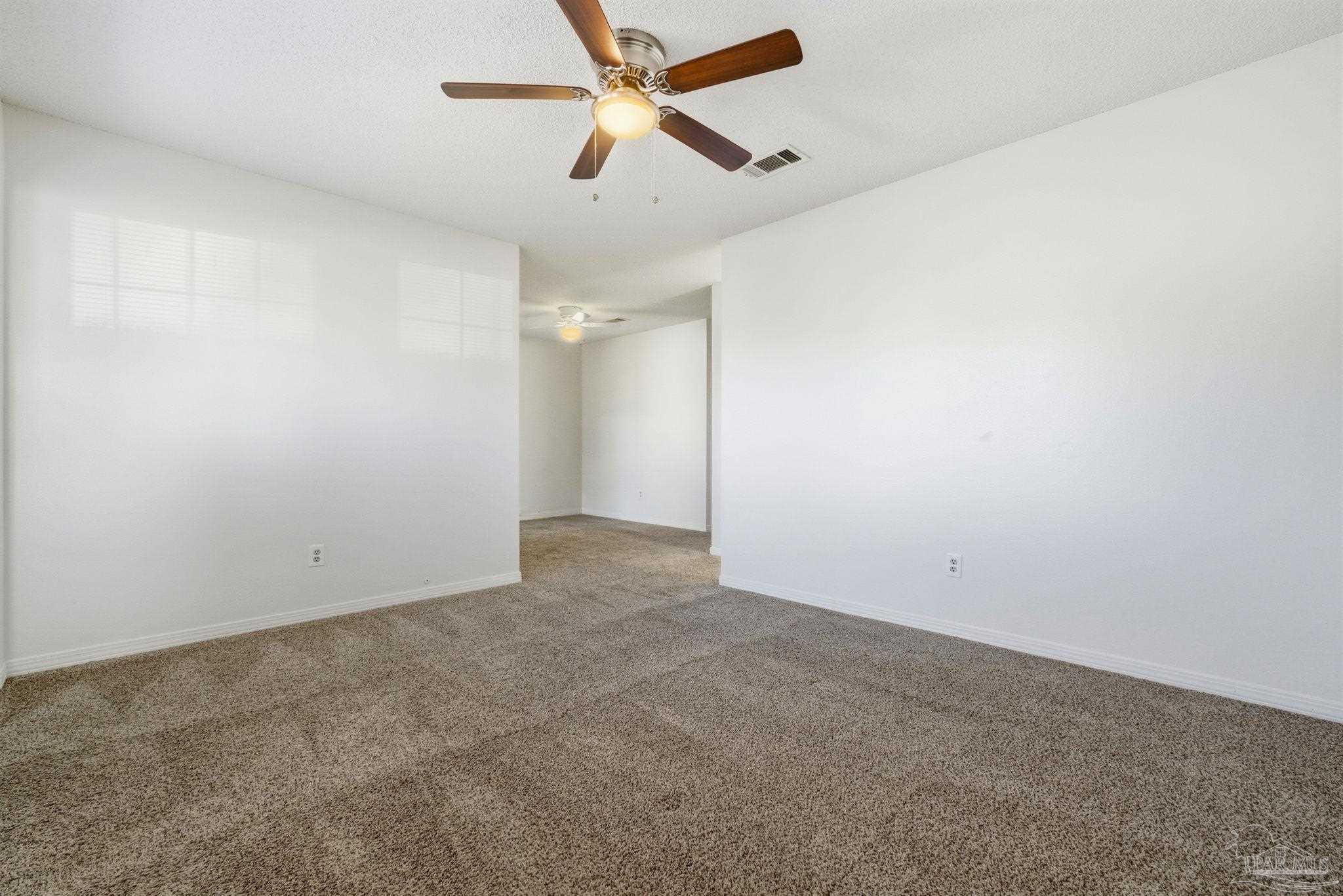 3228 Copper Ridge Circle Cantonment, FL 32533 - Photo 28 of 38 an empty room with chandelier fan