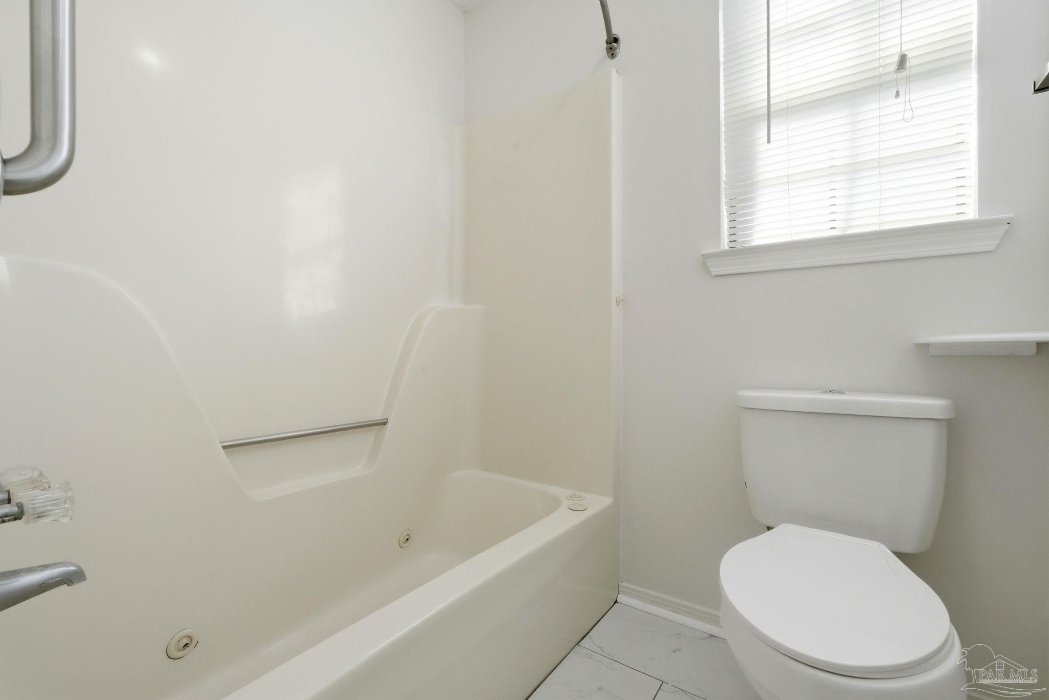 3228 Copper Ridge Circle Cantonment, FL 32533 - Photo 30 of 38 a white toilet sitting next to a bath tub