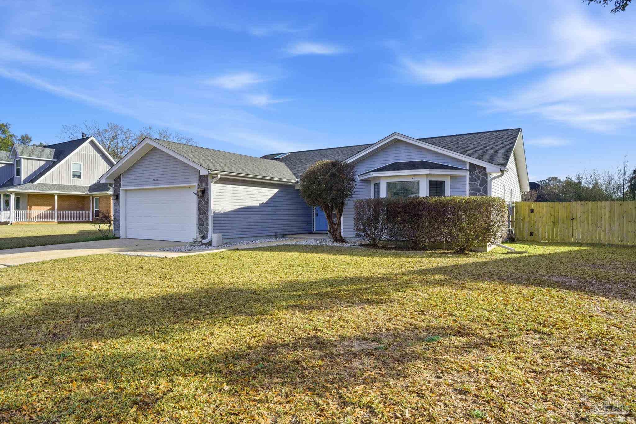 3228 Copper Ridge Circle Cantonment, FL 32533 - Photo 3 of 38 a front view of a house with a yard