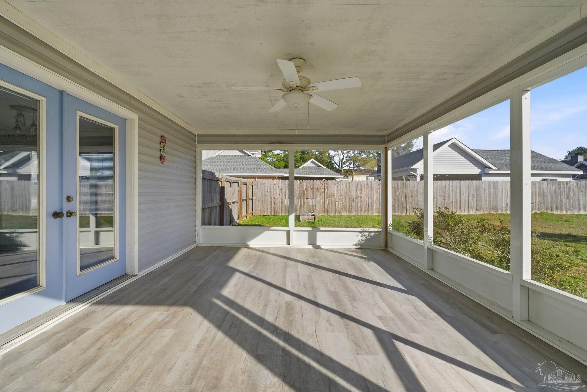 3228 Copper Ridge Circle Cantonment, FL 32533 - Photo 32 of 38 a spacious bedroom with a large window and a balcony