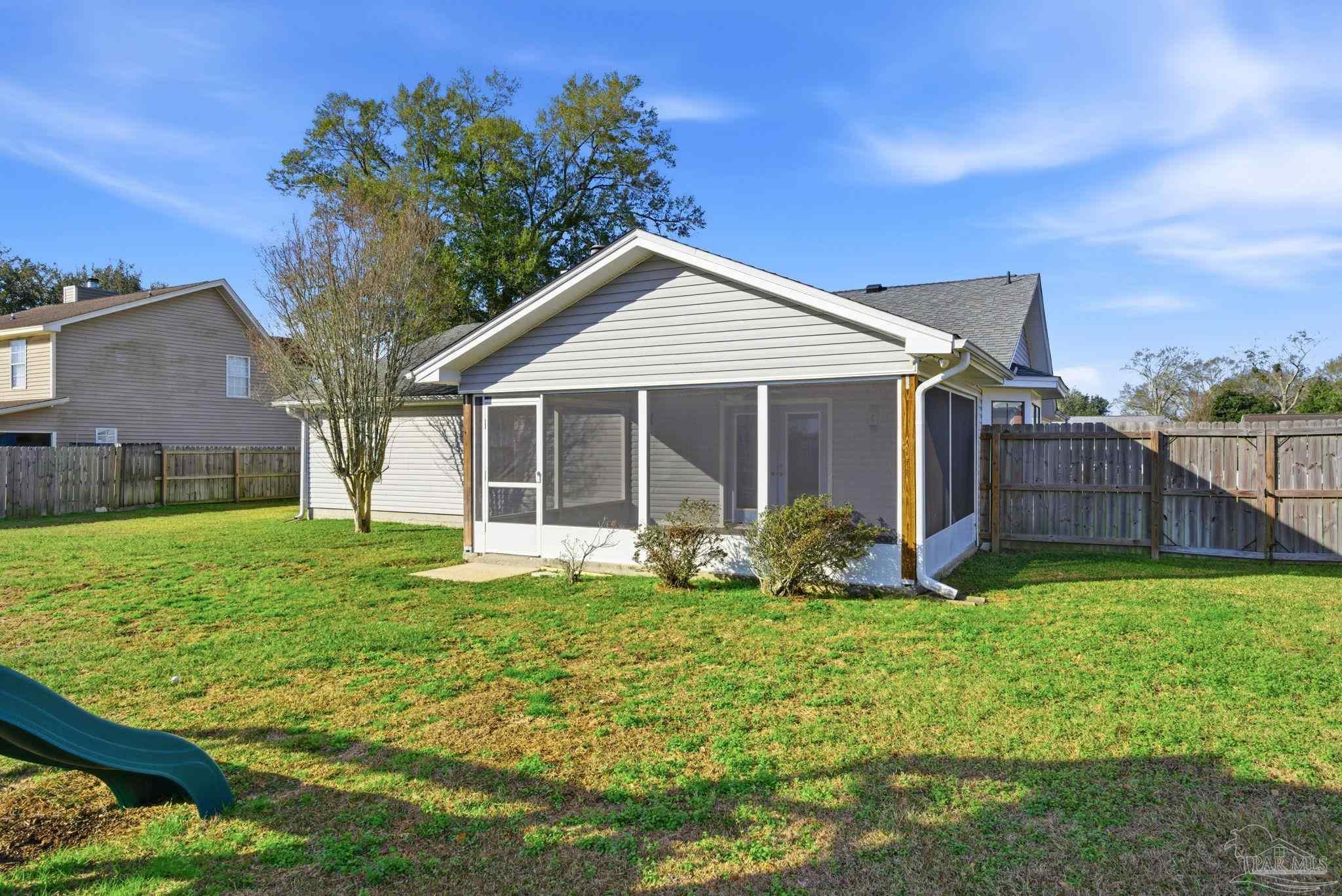 3228 Copper Ridge Circle Cantonment, FL 32533 - Photo 39 of 41 a front view of a house with garden