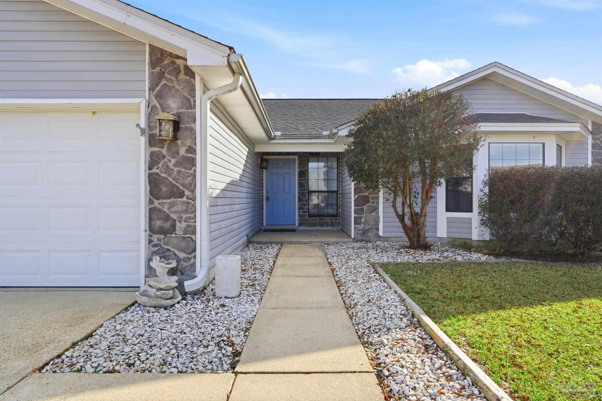 3228 Copper Ridge Circle Cantonment, FL 32533 - Photo 4 of 38 a view of a pathway with a house