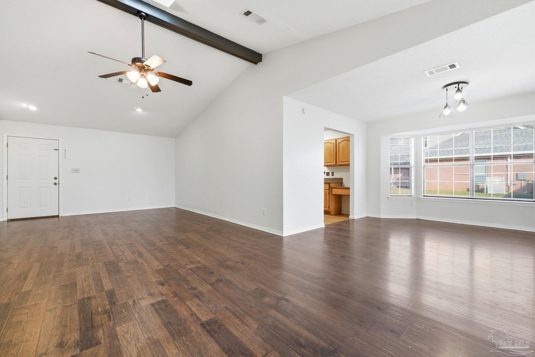 3228 Copper Ridge Circle Cantonment, FL 32533 - Photo 9 of 41 a view of an empty room with a window and wooden floor