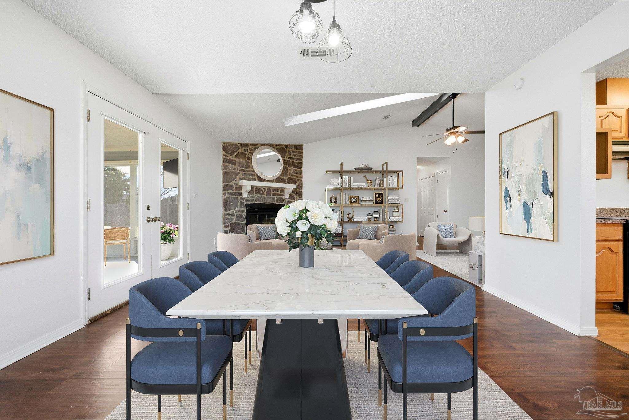 3228 Copper Ridge Circle Cantonment, FL 32533 - Photo 10 of 41 a view of a dining room with furniture window and wooden floor