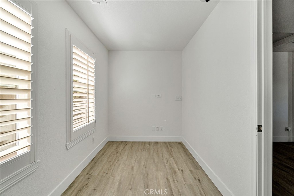 692 Blueberry Lane Madera, CA 93638 - Photo 25 of 44 a view of a room that has wooden floor and window in a room