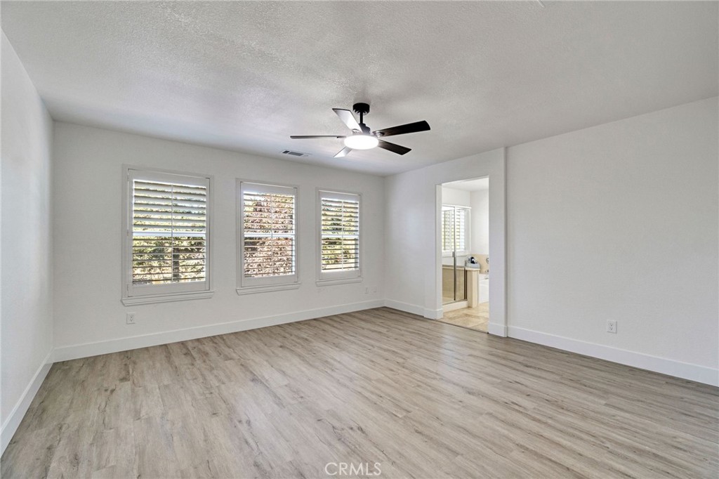 692 Blueberry Lane Madera, CA 93638 - Photo 29 of 44 wooden floor in an empty room with a window