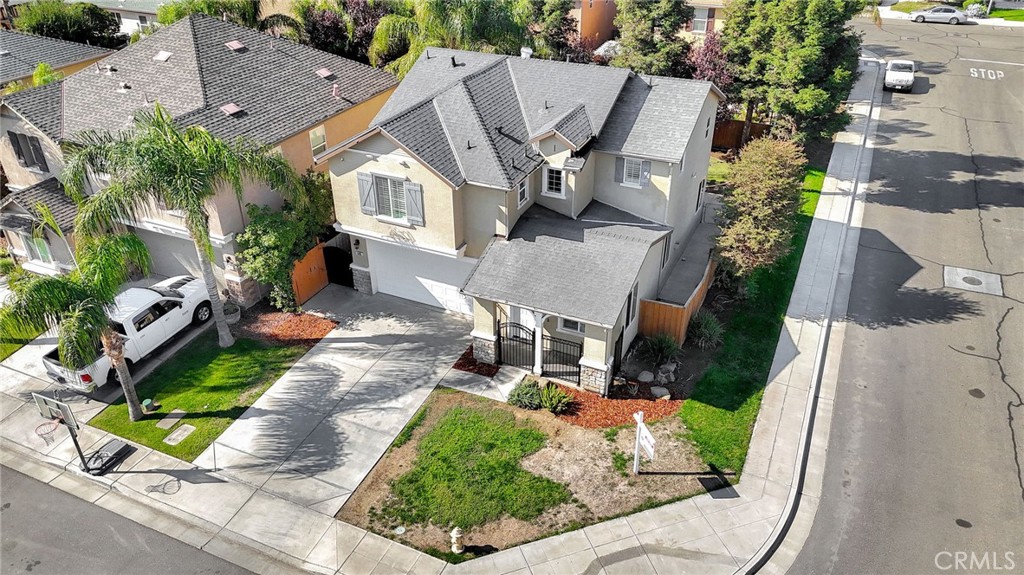 692 Blueberry Lane Madera, CA 93638 - Photo 39 of 44 an aerial view of a house with garden space and sitting area