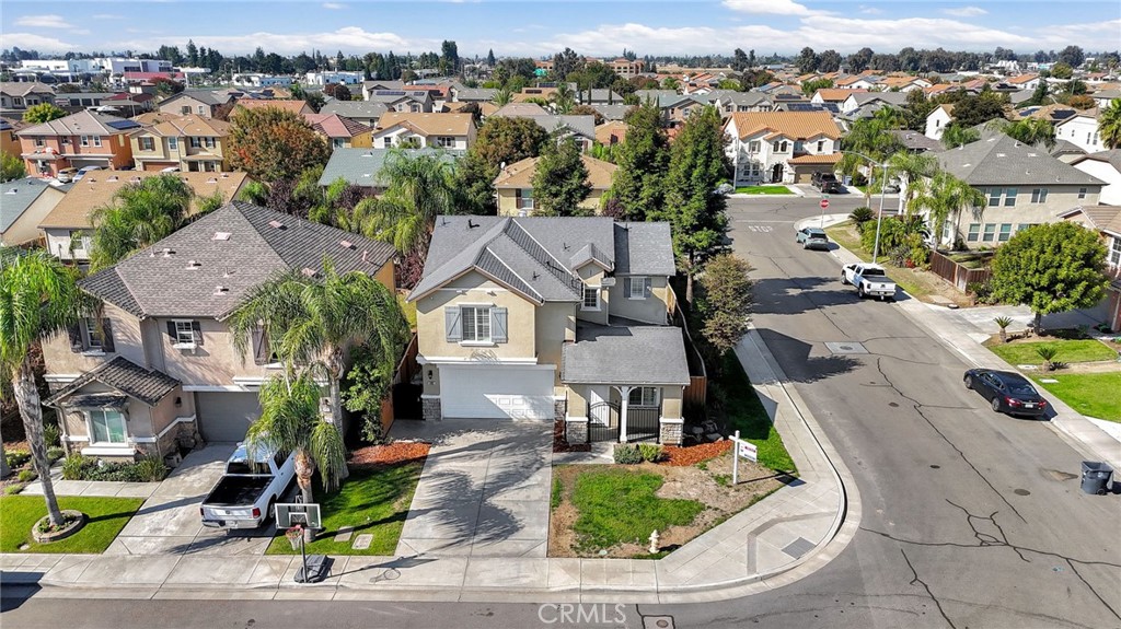692 Blueberry Lane Madera, CA 93638 - Photo 40 of 44 an aerial view of a house with garden space and street view